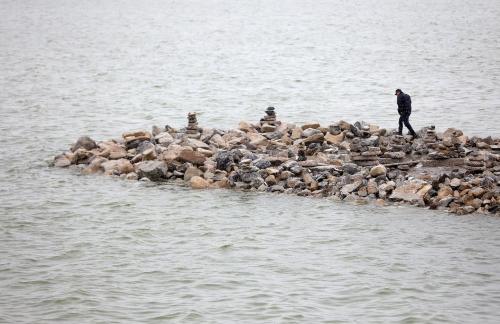 A man explores a jetty in the Great Salt Lake at Great Salt Lake State Park in Salt Lake County on Wednesday, Feb. 7, 2024. | Kristin Murphy, Deseret News